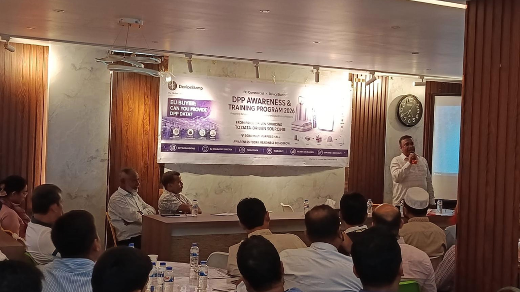 A speaker addresses participants at the DeviceStamp DPP Awareness and Training Programme in Dhaka.
